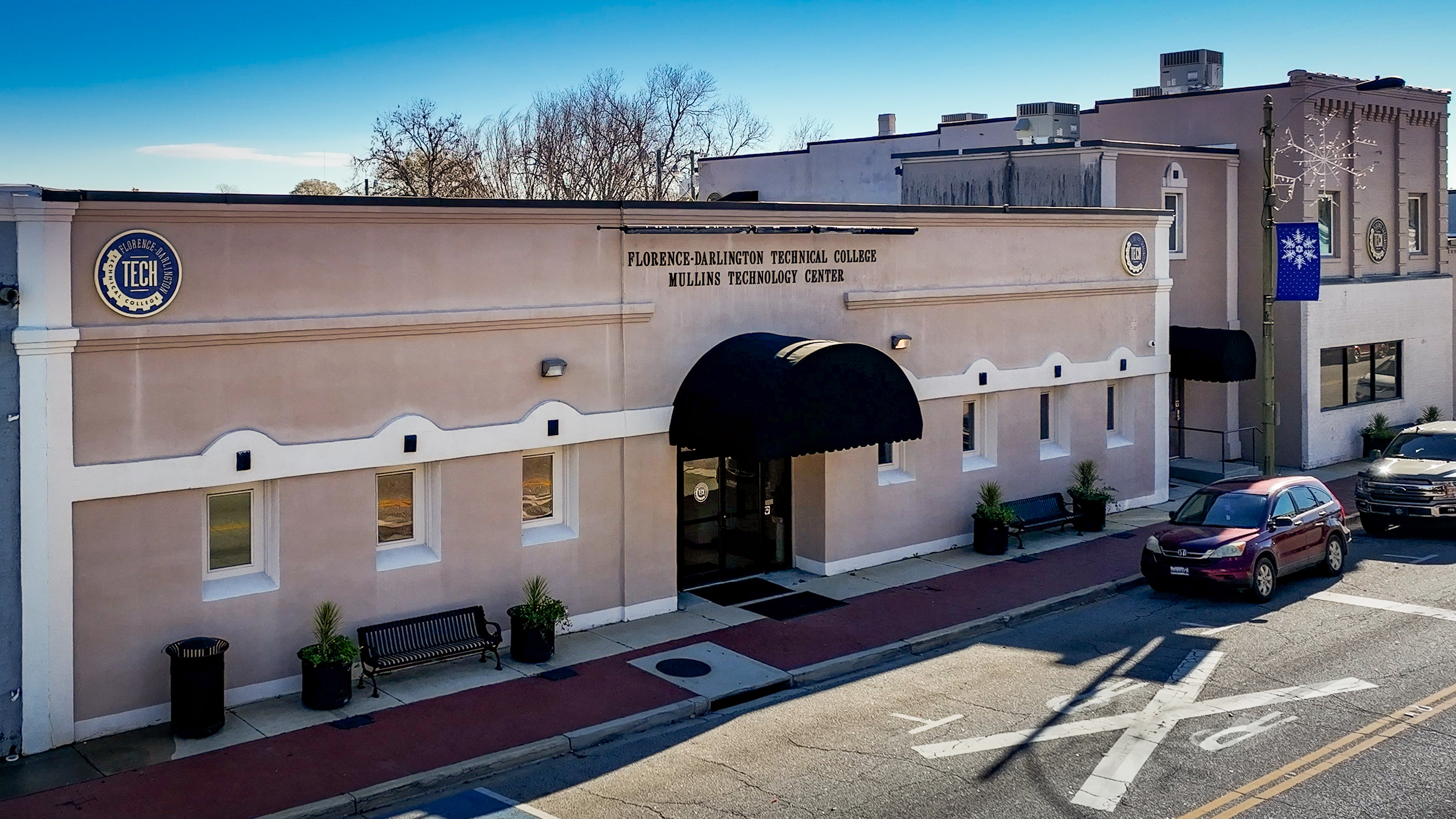 An exterior photograph of the Mullins Campus.