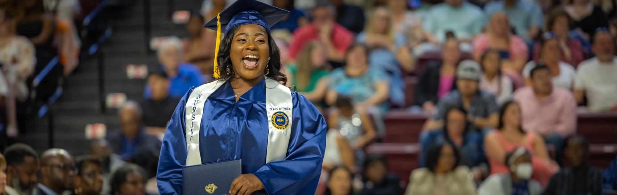 an image of a FDTC student who is very happy to graduate with a degree from Florence-Darlington Techncal College