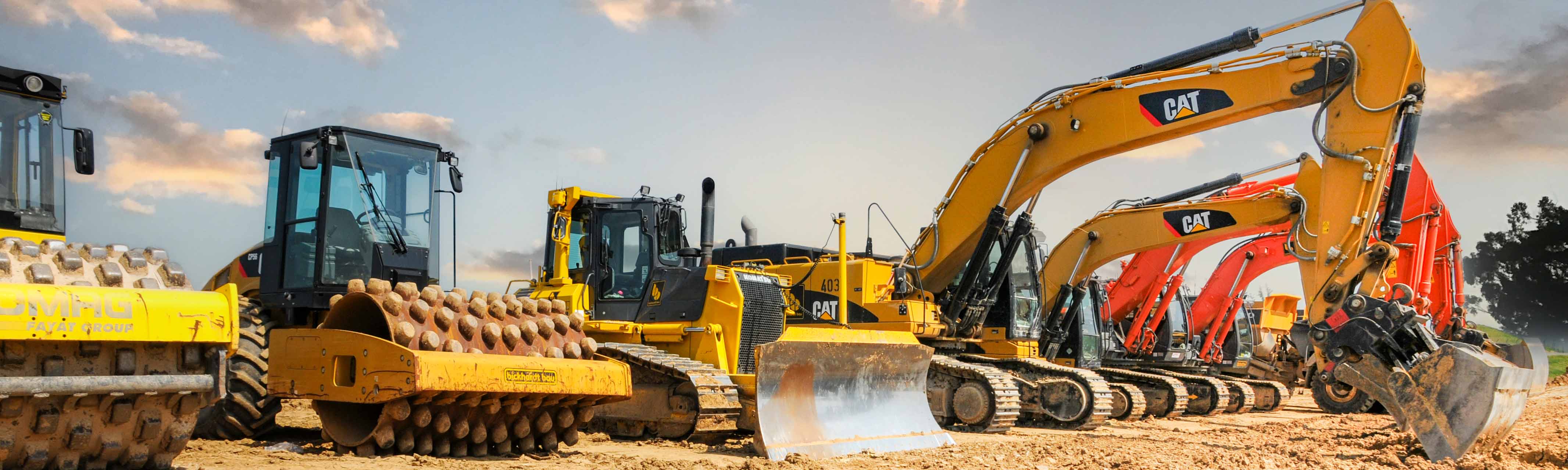 Photograph of assorted CAT heavy diesel equipment.