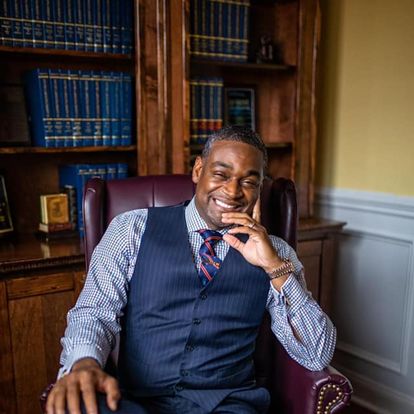 An image of Linward C. Edwards sitting in his office.