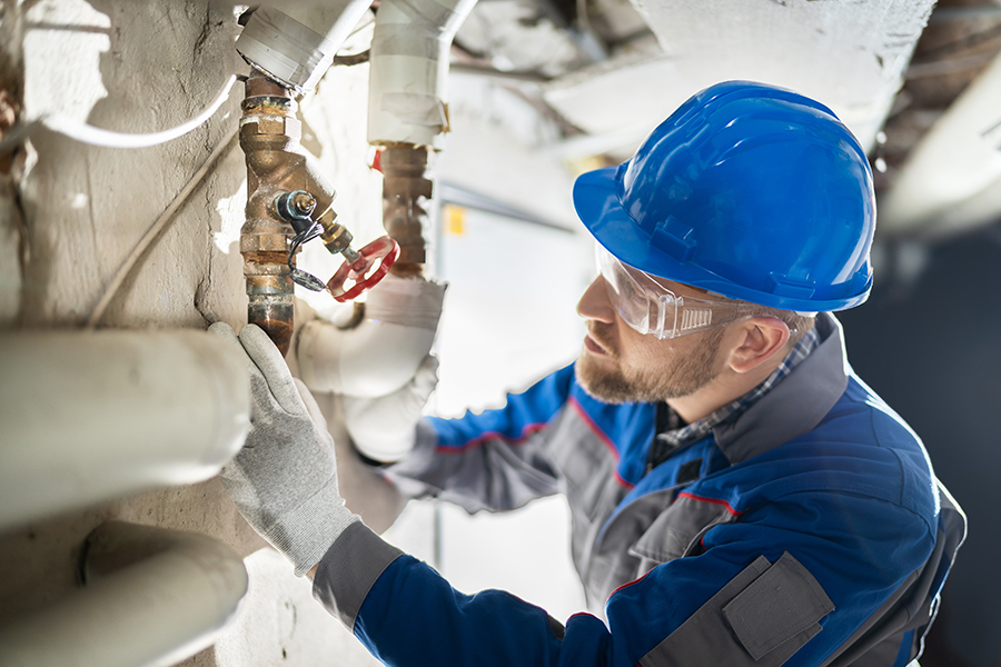 A picture of a plumber working