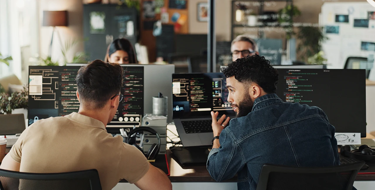 A photo of software engineers sitting at computers